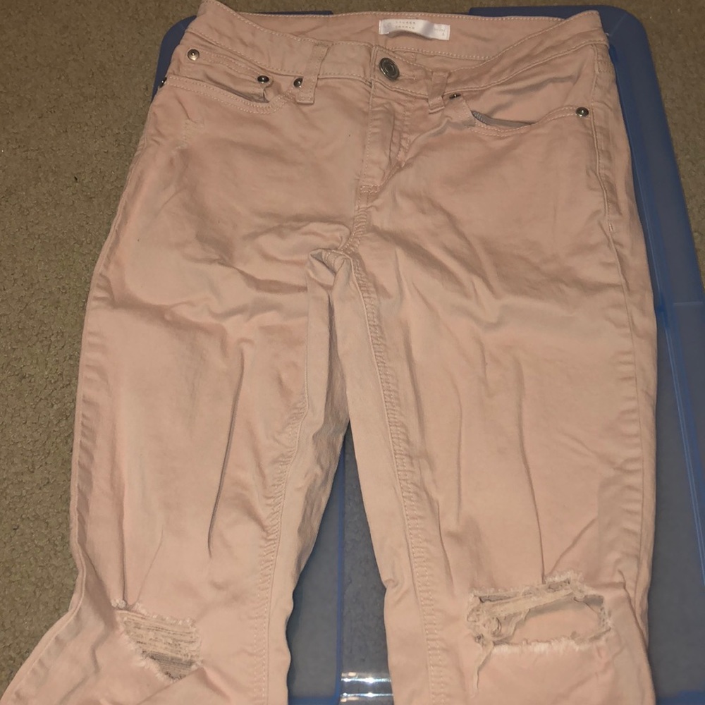 ripped pink jeans